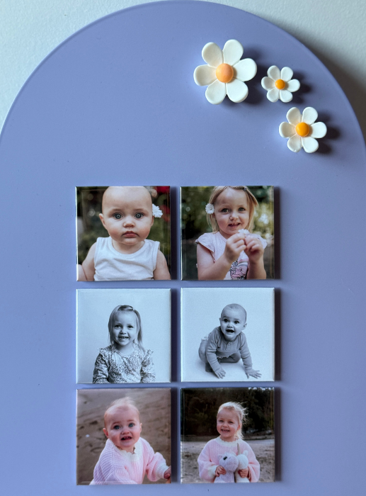 Custom photo magnets displayed on refrigerator showing family memories