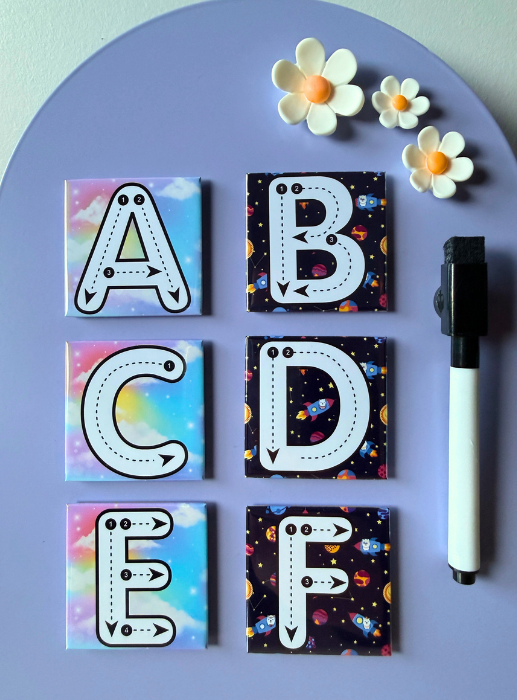 Educational ABC magnets displayed on refrigerator for kids learning.